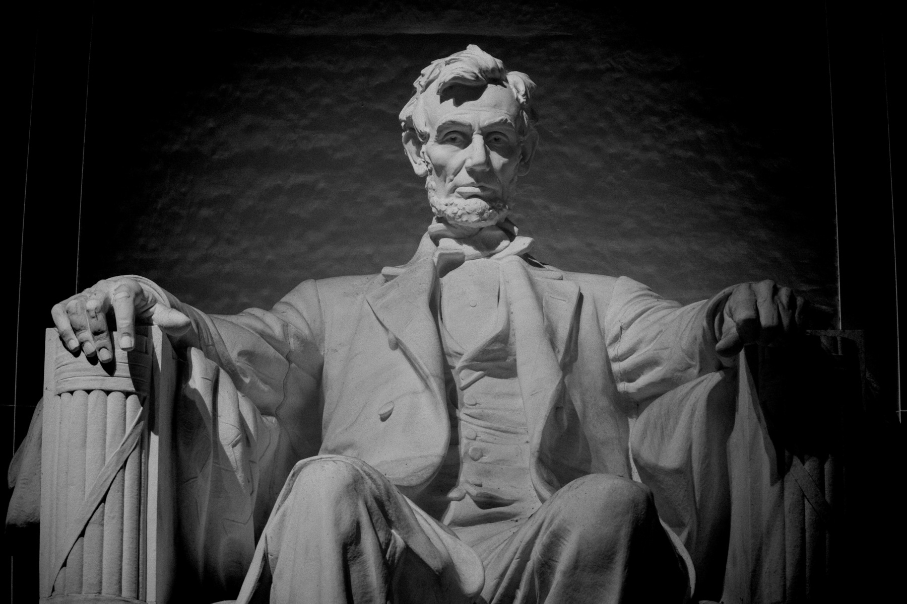 A black and white photo at the Lincoln Memorial. 